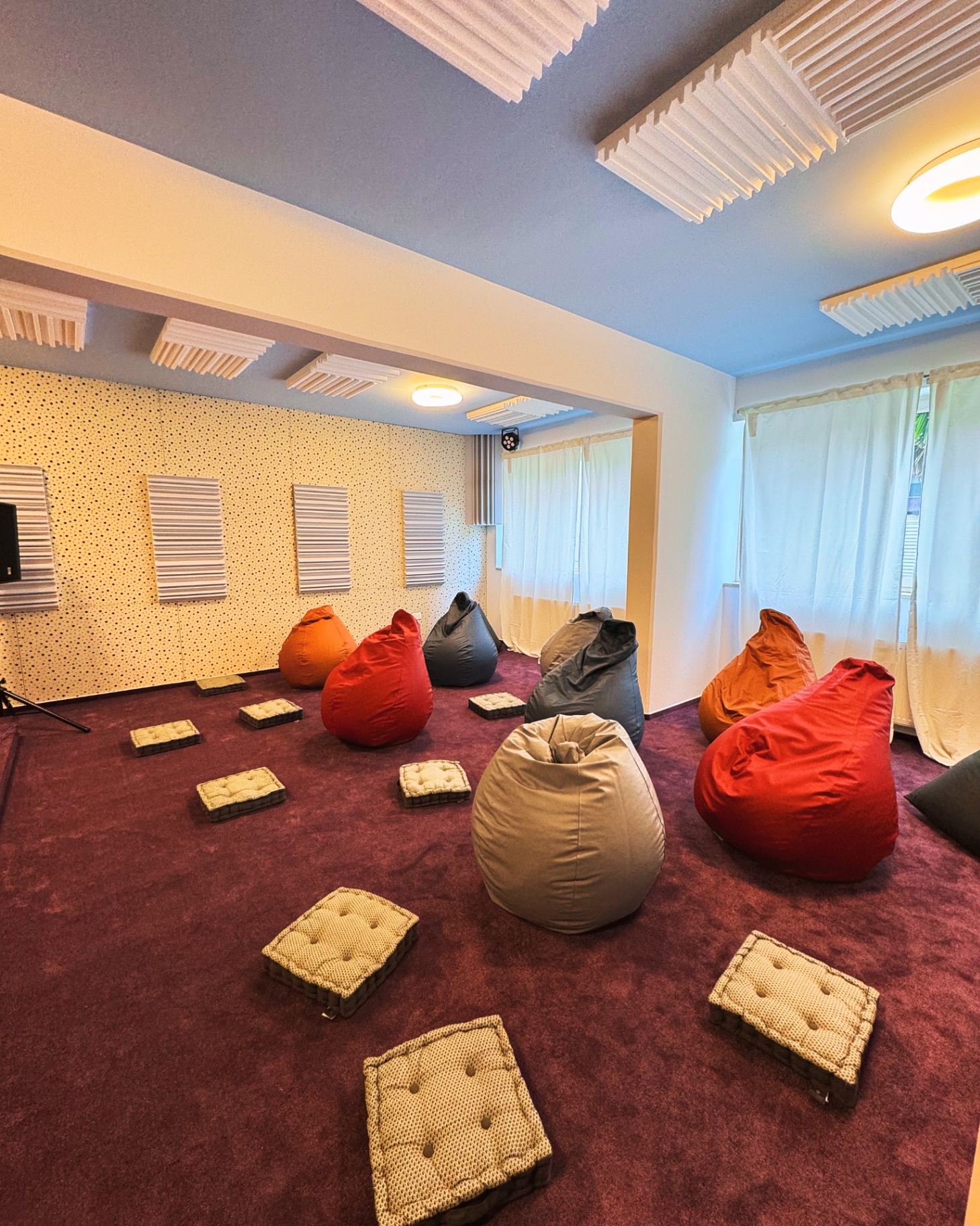Main hall with beanbags and floor cushions